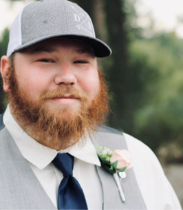 groom wearing ball cap